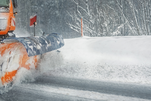 Snowplow,truck,removing,dirty,snow,from,city,street,or,highway